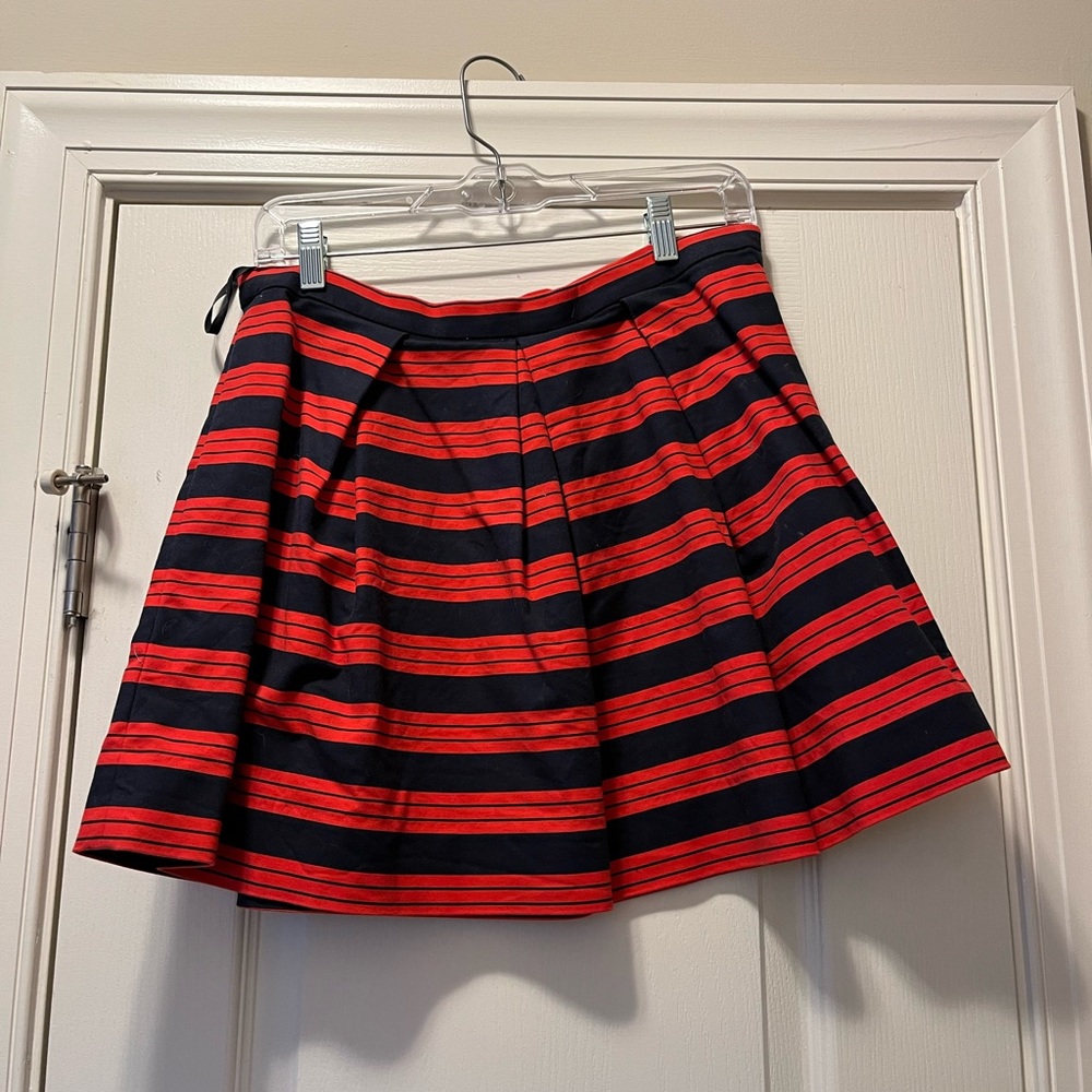 Pleated mini skirt. Navy and red strips. Size 8.